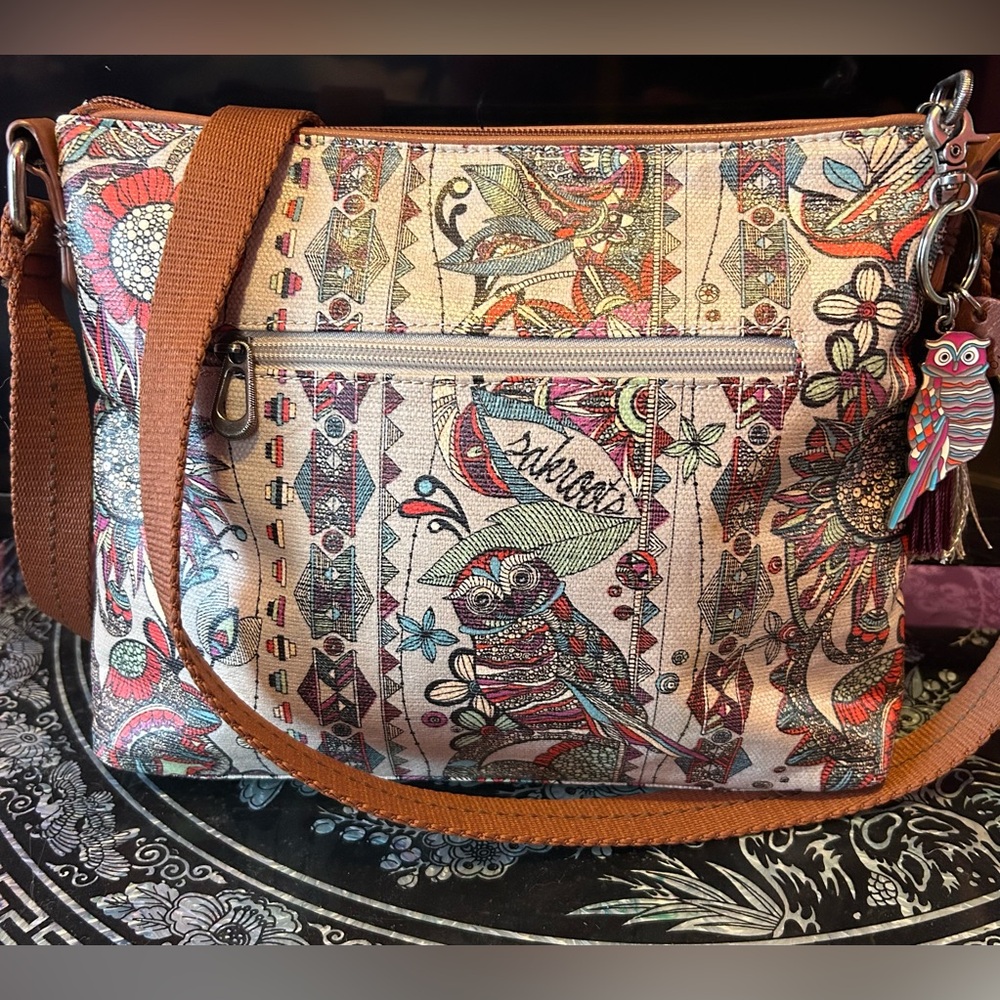SAK ROOTS OWL CROSSBODY BAG. Has owl charm and tassels. Adjustable strap. NWOT